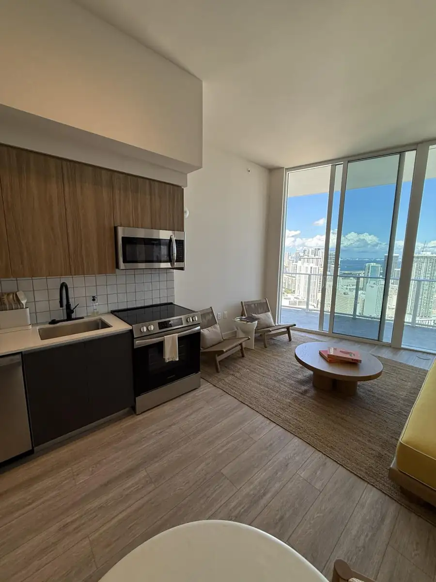 Living area with floor-to-ceiling bay views